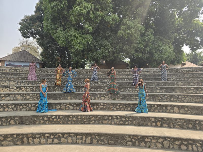 Dancers in Ankara gowns on amphitheatre steps — The Book of Nehemiah